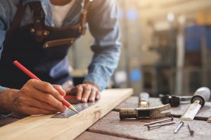 Man in  workshop doing woodwork