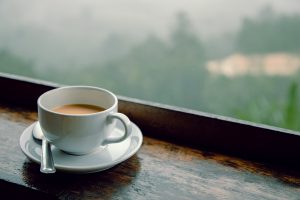 Cup of coffee sitting on window sill