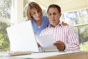 Middle-aged couple looking at documents