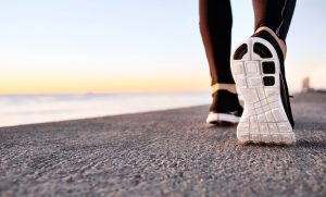 Person walking along the beach, transformation