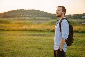 Young man outside, thinking and processing