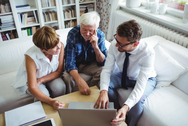 Show funeral director helping couple through the planning process