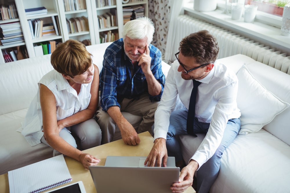 Show funeral director helping couple through the planning process