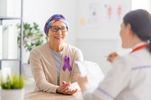 Shows a woman with cancer requesting additional care
