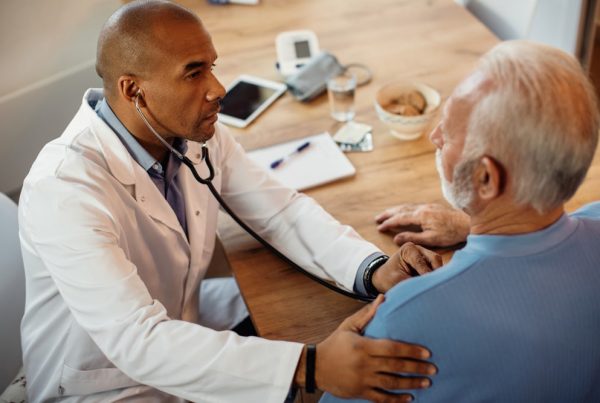 shows man talking to his doctor about his health