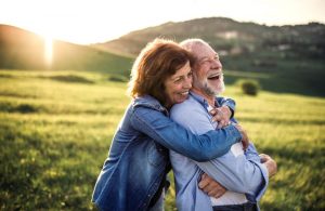 couple laughing outside together