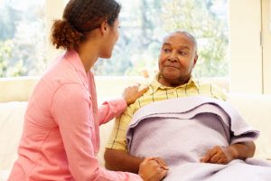 Adult daughter caring for sick dad at home