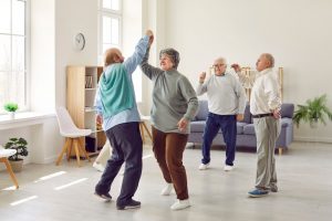 seniors in hospice dancing to music