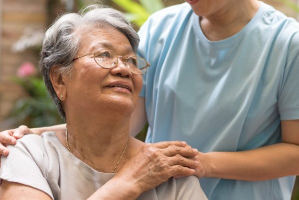 Nurse and female patient interacting together