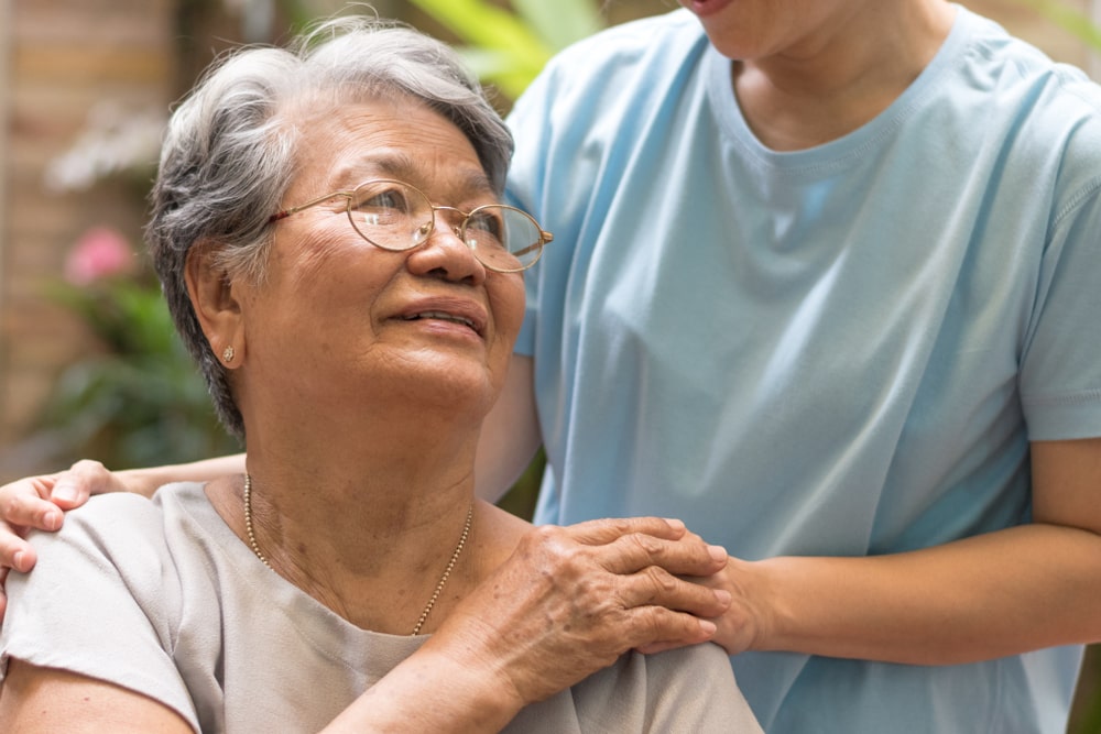 Nurse and female patient interacting together