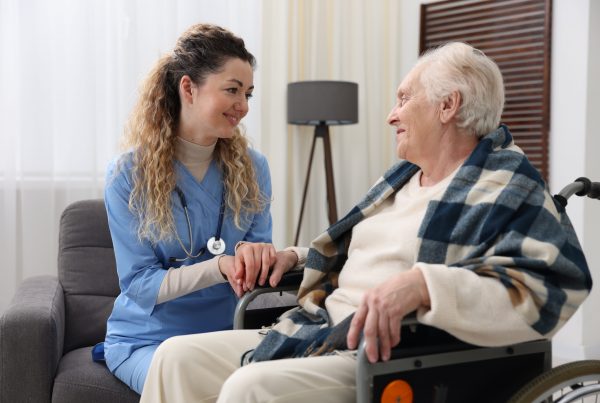 Hospice worker talking to patient